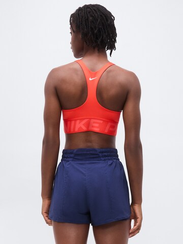 NIKE Μπουστάκι Αθλητικό σουτιέν σε πορτοκαλί
