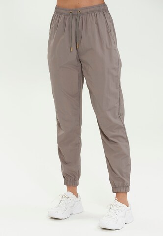 Athlecia Regular Workout Pants 'Tharbia' in Beige: front