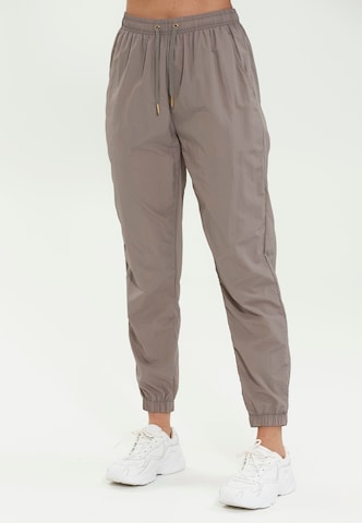 regular Pantaloni sportivi 'Tharbia' di Athlecia in beige: frontale