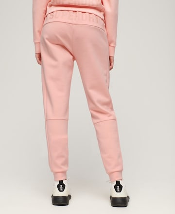 Coupe slim Pantalon de sport Superdry en rose