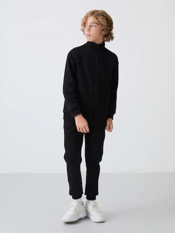 Tommy Life Trainingspak 'TOMMY Kinder Sport-Set' in Zwart