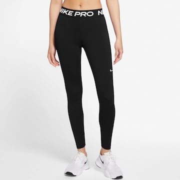 NIKE Sports trousers in Black: front