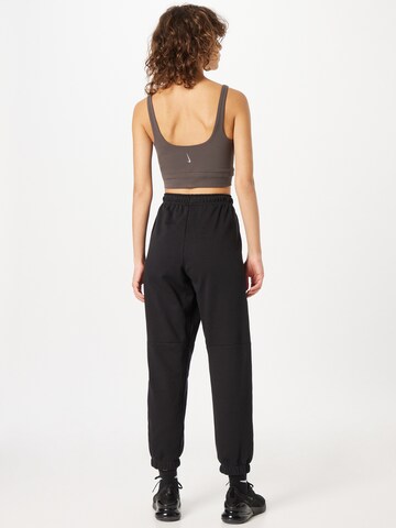 Effilé Pantalon 'AIR' Nike Sportswear en noir