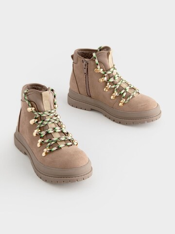 Bottes Next en beige