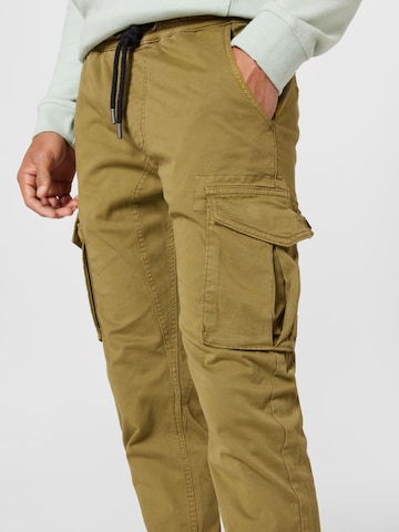 ALPHA INDUSTRIES Tapered Παντελόνι cargo σε καφέ