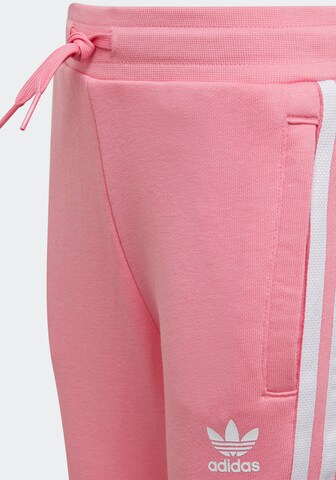 ADIDAS ORIGINALS Träningsoverall 'Adicolor Crew' i rosa