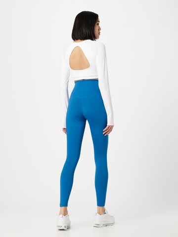 NIKE Skinny Športne hlače 'One' | modra barva