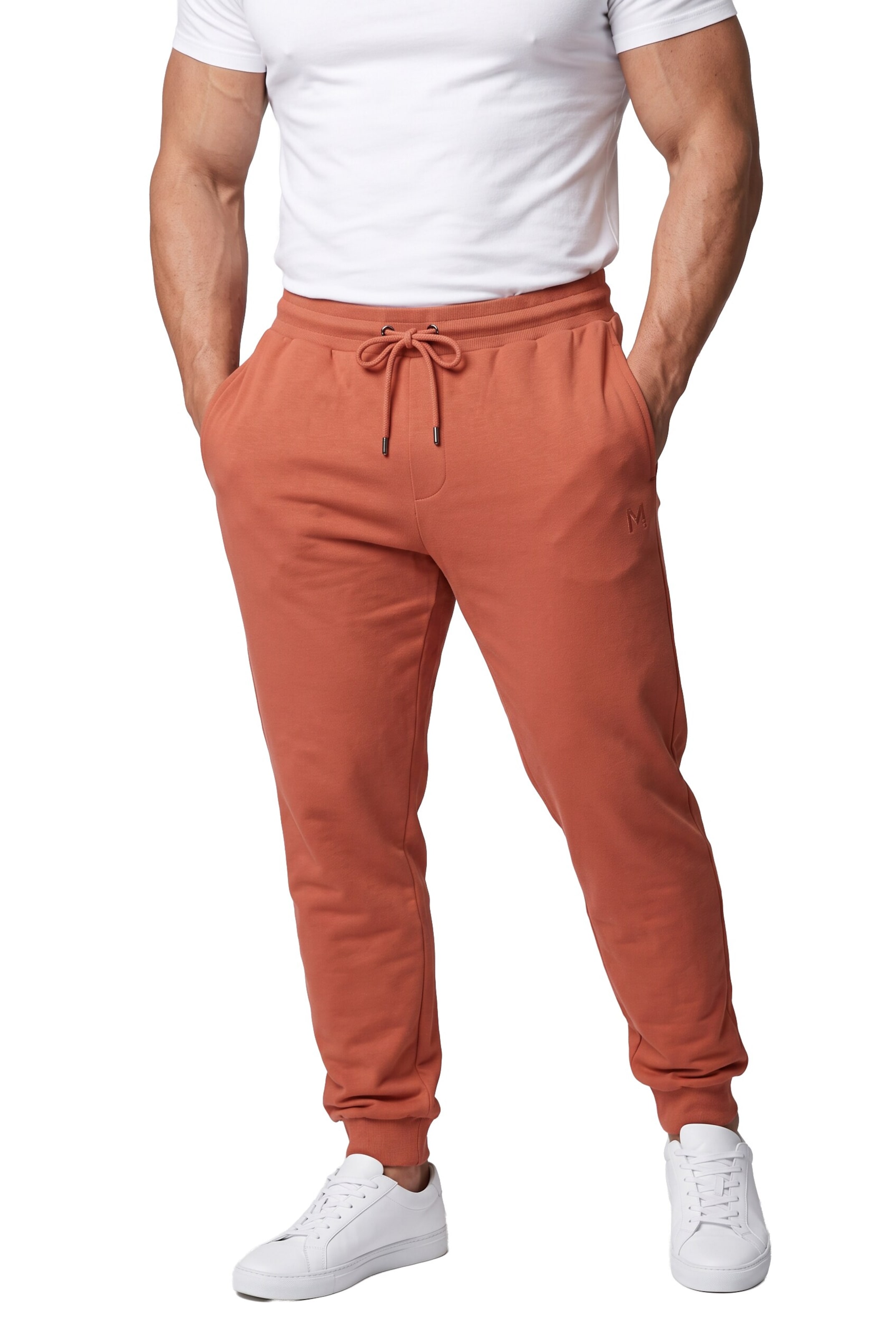 Men Plus Tapered Pants in Brown: front