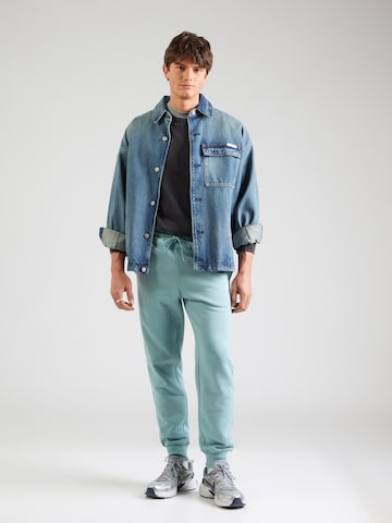 Nike Sportswear Tapered Παντελόνι 'CLUB' σε πράσινο