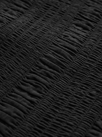 Combinaison Next en noir