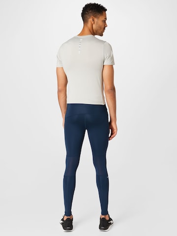 ASICS Skinny Spodnie sportowe w kolorze niebieski