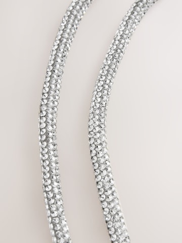 Next Handytrageriemen in Silber