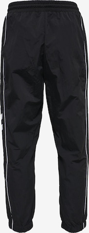 Effilé Pantalon de sport 'Walter' Hummel en noir