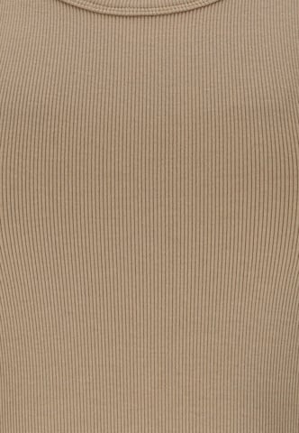 Athlecia Sports top 'Lenga' in Brown