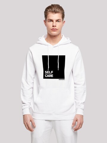 Sweat-shirt 'SELF CARE' F4NT4STIC en blanc : devant