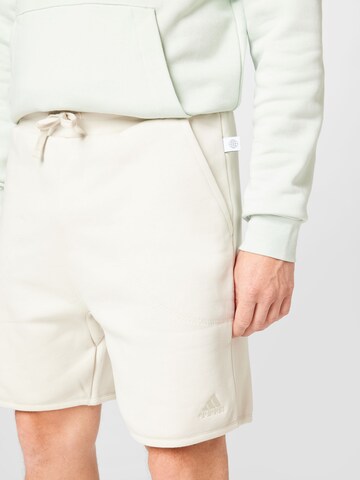 regular Pantaloni sportivi 'Studio Lounge Fleece' di ADIDAS SPORTSWEAR in beige