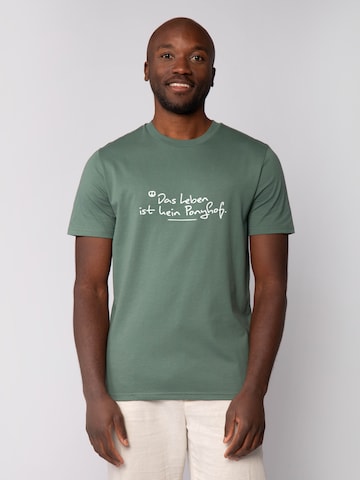 Watapparel Shirt 'Das Leben Ist Kein Ponyhof' in Green: front