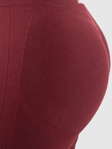 Coupe slim Pantalon de sport ' Nomeli ' Smilodox en rouge