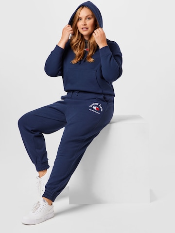 Tommy Jeans Curve Zwężany krój Spodnie w kolorze niebieski