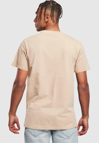 Maglietta 'Never On Time' di Merchcode in beige