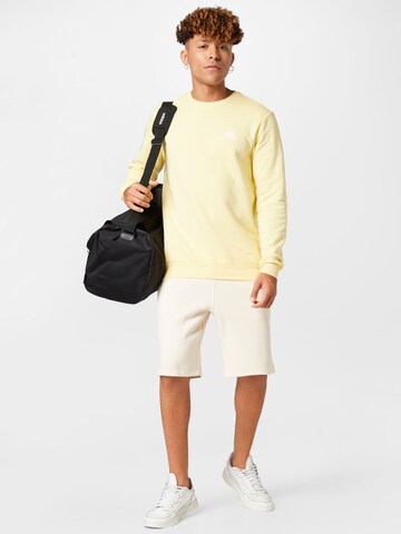 ADIDAS SPORTSWEAR Sports sweatshirt 'Essentials Fleece' in Yellow