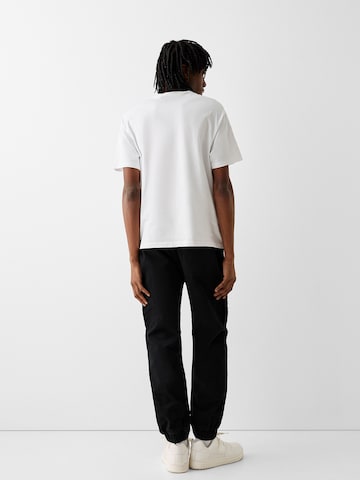 Bershka Tapered Cargobroek in Zwart