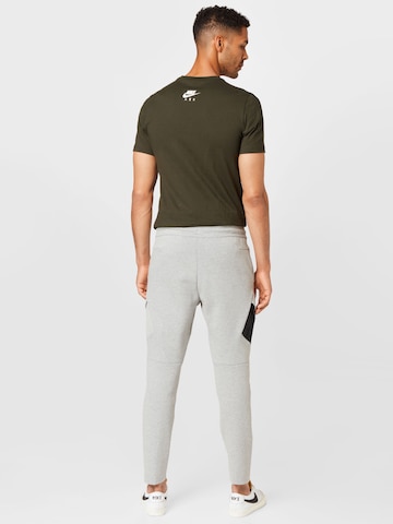 Slimfit Pantaloni de la Nike Sportswear pe gri