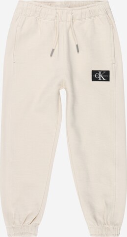 Calvin Klein Jeans Дънки Tapered Leg Панталон в бежово: отпред