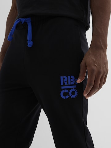 bonprix Tapered Hose in Schwarz