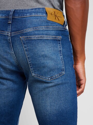 mėlyna Calvin Klein Jeans Prigludęs Džinsai