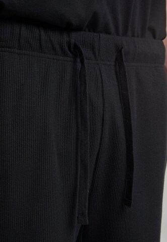 Urban Classics - Loosefit Pantalón en negro