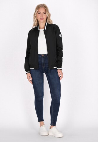 urban rain by Schmuddelwedda Between-season jacket in Black