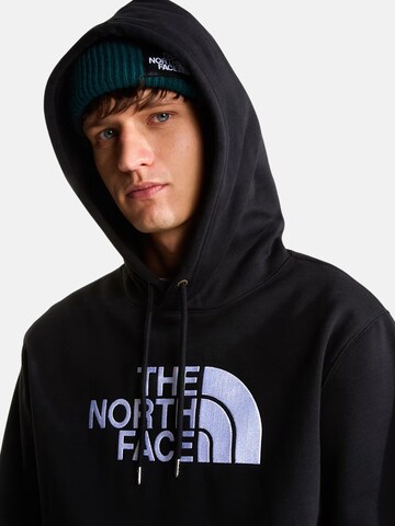 THE NORTH FACE Bluzka sportowa 'THE NORTH FACE M ESS DP REG HODDIE FELPA' w kolorze czarny