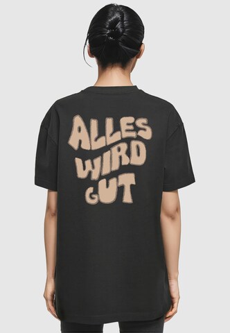 Merchcode T-Shirt 'Alles Wird Gut' in Schwarz: Vorderseite