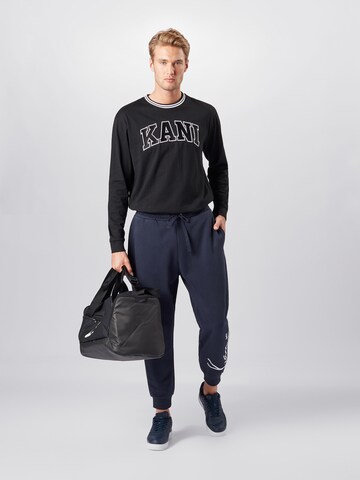 Karl Kani Tapered Pants 'Signature' in Blue