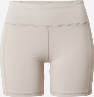 Skinny Pantalon de sport Reebok en beige : devant