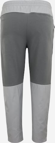 Nike Sportswear Zwężany krój Spodnie w kolorze szary