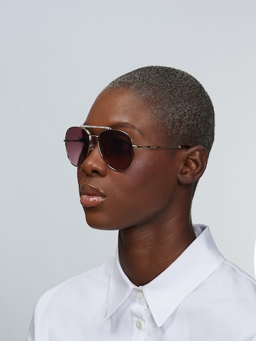 Miu Miu Sunglasses in Gold