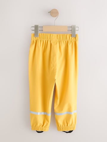 Next - Tapered Pantalón funcional en amarillo