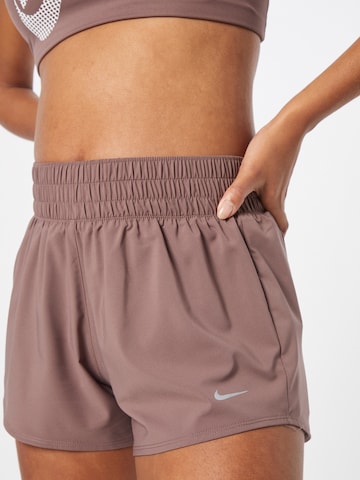 NIKE - Regular Calças de desporto em roxo