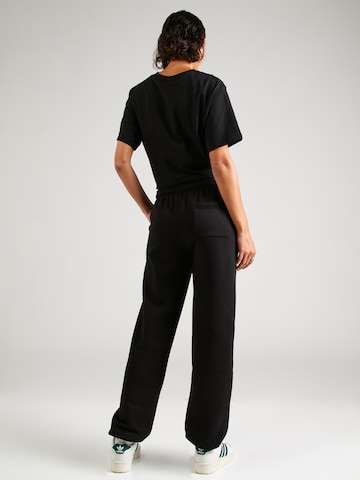 ELLESSE Tapered Trousers in Black