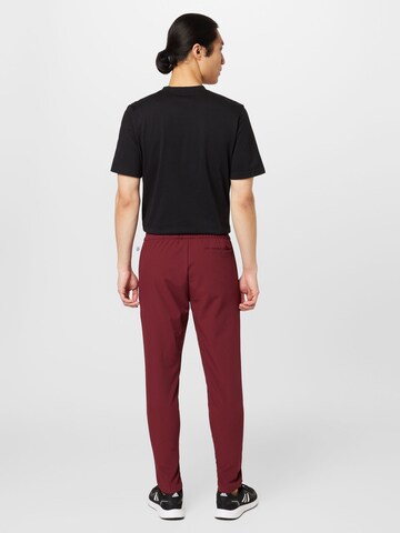 ADIDAS SPORTSWEAR Tapered Sportbroek 'City Escape' in Rood