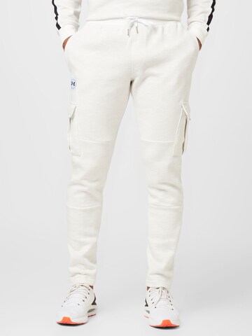 UNDER ARMOUR Tapered Sports trousers in White: front