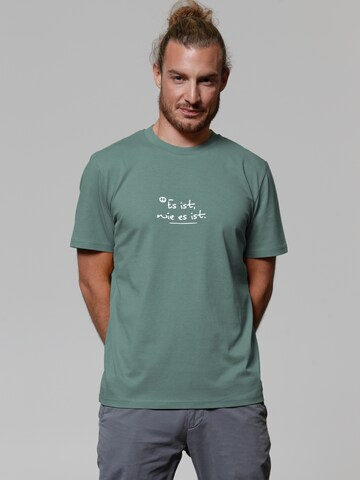 T-Shirt 'Es Ist Wie Es Ist' Watapparel en vert : devant