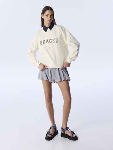 Sweat-shirt Twist en beige