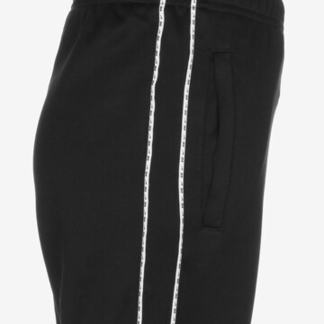 Tapered Pantaloni de la Nike Sportswear pe negru