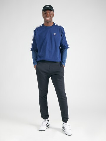 ADIDAS ORIGINALS Tapered Παντελόνι 'Essential' σε μαύρο