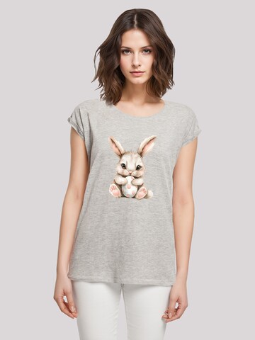 T-shirt 'Niedlicher Osterhase mit Ei' F4NT4STIC en gris : devant