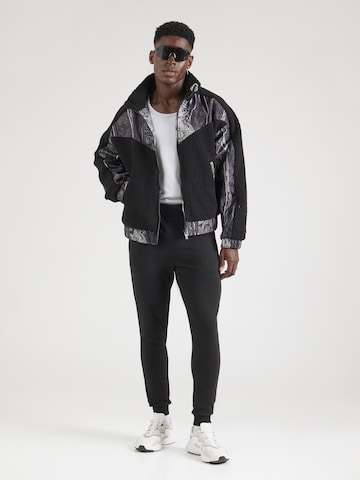 ELLESSE Tapered Sports trousers 'Berlingo' in Black