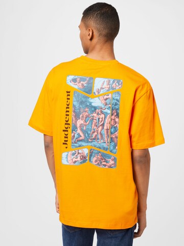 NU-IN T-shirt 'Judgement' i orange